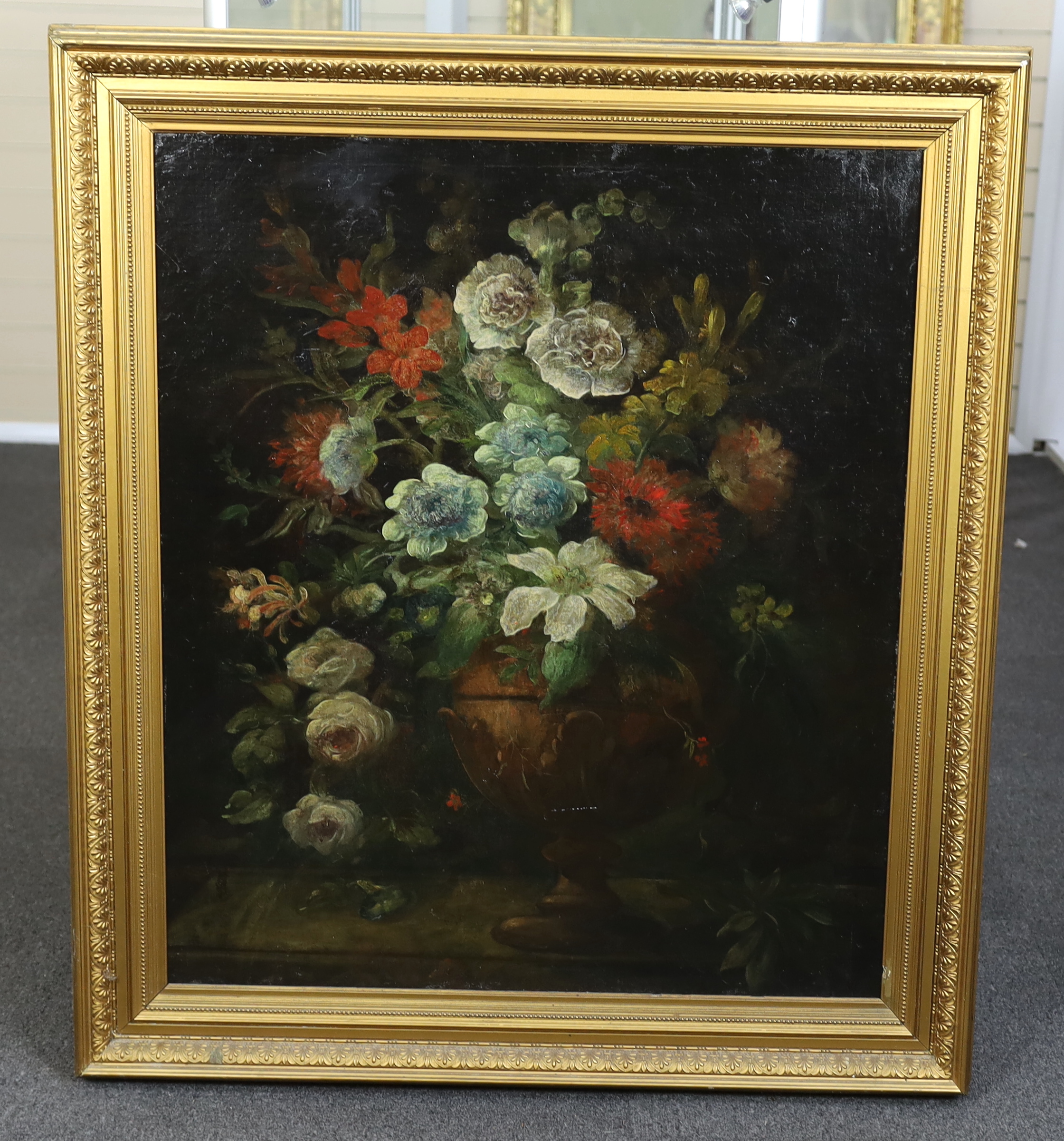 19th century Continental School , 17th century style still life of flowers in a vase upon a ledge, oil on canvas laid on board, 87 x 74cm